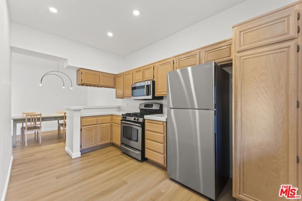 Dining room, Interior, Kitchen, Recessed Lighting, Stainless Steel Appliances, Wood Texture Flooring