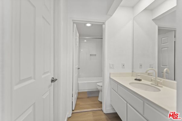 Bathroom, Dual Sink Vanities, Interior, Recessed Lighting, Wood Texture Flooring