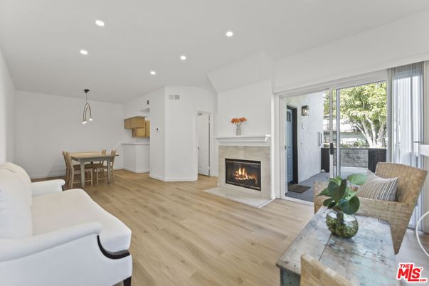 Dining room, Fireplace, Interior, Living room, Pendant Lights, Recessed Lighting, Wood Texture Flooring