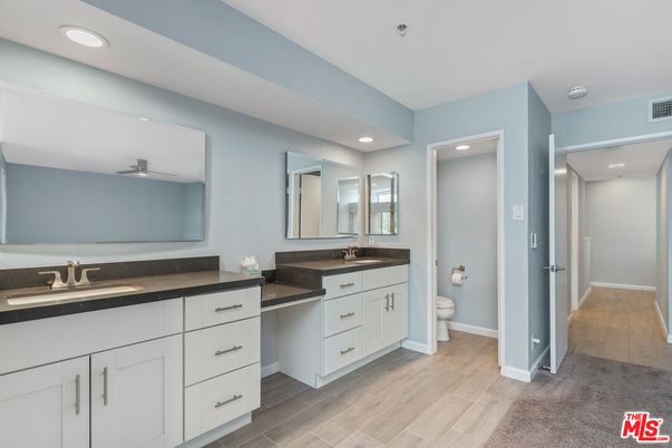 Bathroom, Dual Sink Vanities, Interior, Recessed Lighting, Wood Texture Flooring