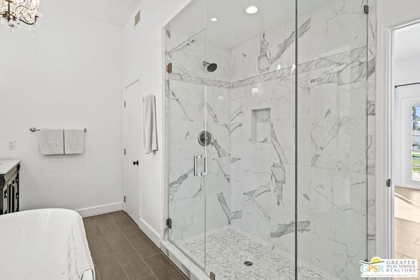 Bathroom, Free Standing Baths, Glass Shower, Interior, Marble Walls, Recessed Lighting, Wood Texture Flooring
