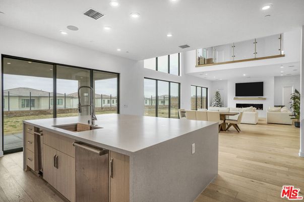 Dining room, Fireplace, Interior, Kitchen, Living room, Recessed Lighting, Wood Texture Flooring