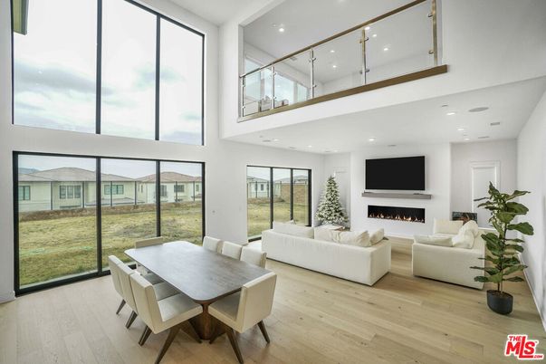 Dining room, Fireplace, Interior, Living room, Recessed Lighting, Wood Texture Flooring