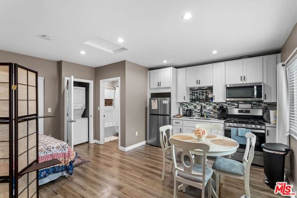 Dining room, Interior, Kitchen, Recessed Lighting, Stainless Steel Appliances, Wood Texture Flooring