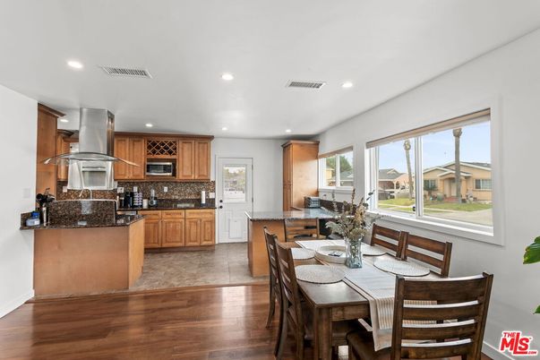 Dining room, Interior, Kitchen, Recessed Lighting, Stainless Steel Appliances, Wood Texture Flooring
