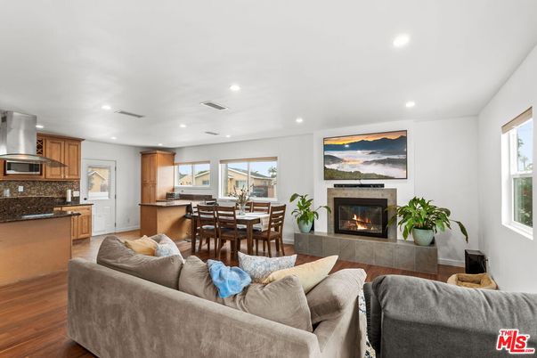 Dining room, Fireplace, Interior, Kitchen, Living room, Recessed Lighting, Wood Texture Flooring