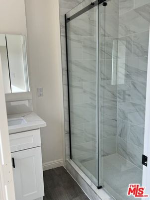 Bathroom, Glass Shower, Interior, Marble Walls, Wood Texture Flooring