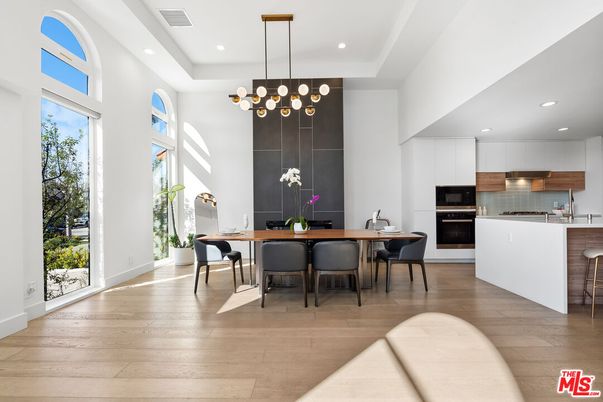 Chandelier, Dining room, Interior, Kitchen, Pendant Lights, Recessed Lighting, Stainless Steel Appliances, Wood Texture Flooring