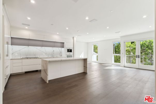 Interior, Kitchen, Marble Walls, Recessed Lighting, Stainless Steel Appliances, Wood Texture Flooring