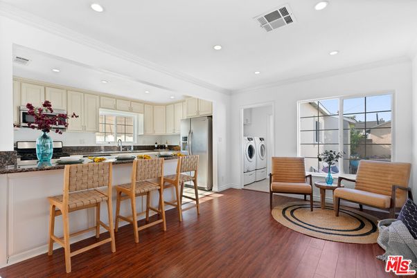 Interior, Kitchen, Recessed Lighting, Washer, Wood Texture Flooring