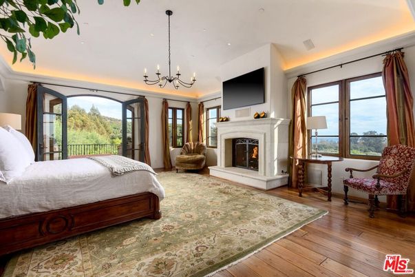 Bedroom, Chandelier, Fireplace, Interior, Recessed Lighting, Wood Texture Flooring