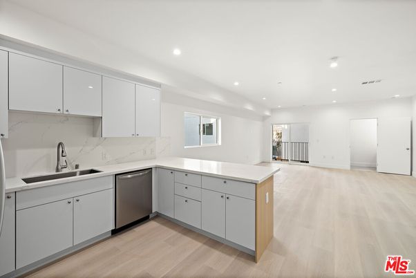 Interior, Kitchen, Marble Walls, Recessed Lighting, Stainless Steel Appliances, Wood Texture Flooring