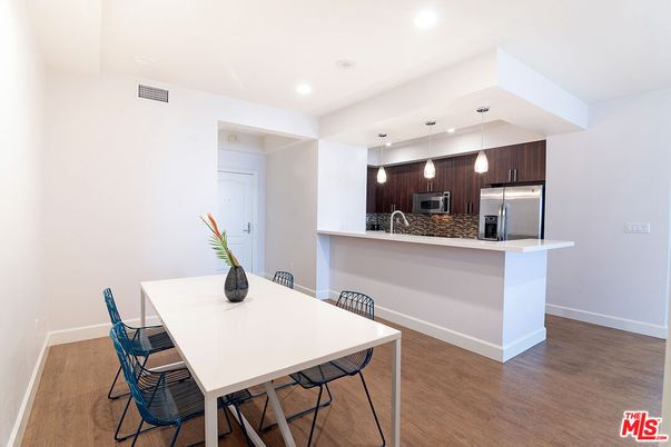 Dining room, Interior, Kitchen, Pendant Lights, Recessed Lighting, Stainless Steel Appliances, Wood Texture Flooring