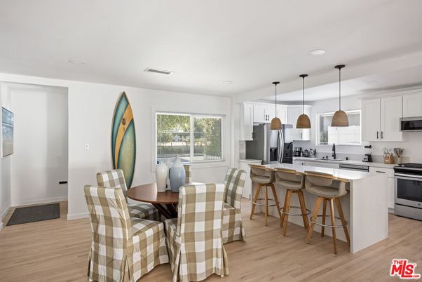 Dining room, Interior, Kitchen, Pendant Lights, Recessed Lighting, Stainless Steel Appliances, Wood Texture Flooring