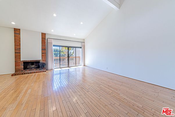 Empty room, Fireplace, Interior, Recessed Lighting, Stone Walls, Wood Texture Flooring