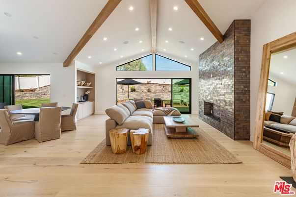 Dining room, Fireplace, Interior, Living room, Recessed Lighting, Stone Walls, Wooden Beams, Wood Texture Flooring