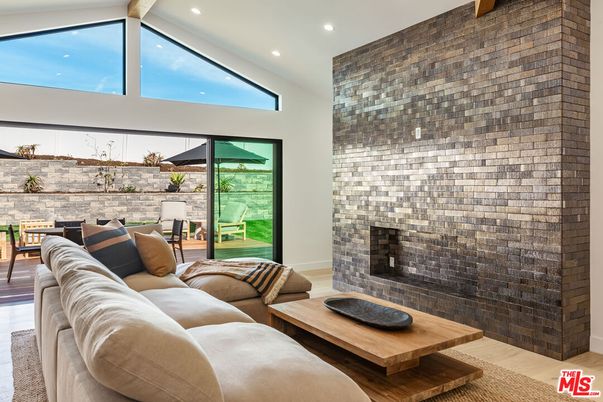 Fireplace, Interior, Living room, Recessed Lighting, Stone Walls, Wood Texture Flooring
