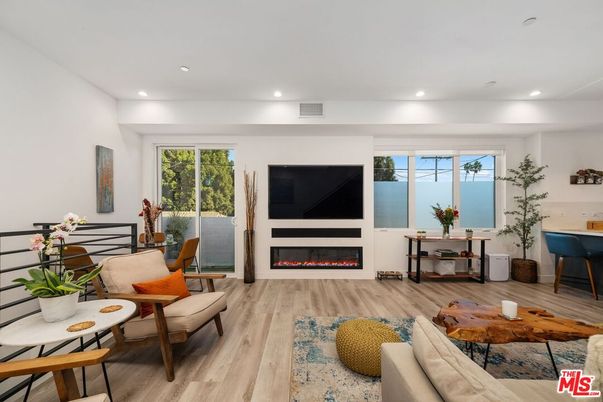 Dining room, Fireplace, Interior, Living room, Recessed Lighting, Wood Texture Flooring