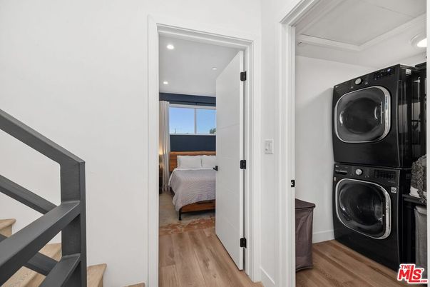 Bedroom, Interior, Recessed Lighting, Utility Closets, Washer, Wood Texture Flooring