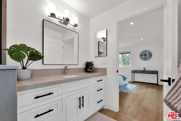 Bathroom, Dual Sink Vanities, Interior, Recessed Lighting, Wood Texture Flooring