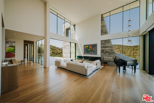 Fireplace, Interior, Living room, Piano, Recessed Lighting, Stone Walls, Wood Texture Flooring