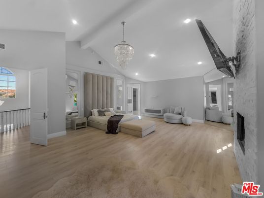 Bedroom, Chandelier, Fireplace, Interior, Recessed Lighting, Wood Texture Flooring
