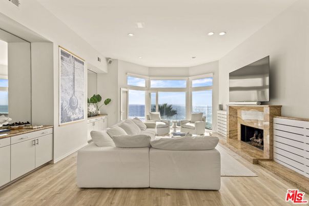 Fireplace, Interior, Living room, Recessed Lighting, Water, Wood Texture Flooring