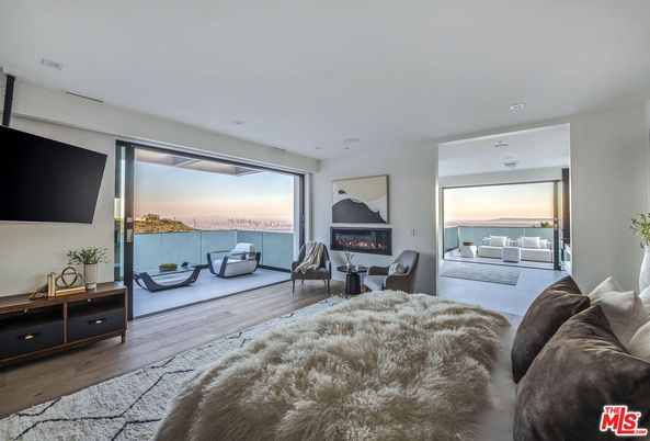 Bedroom, Fireplace, Interior, Living room, Recessed Lighting, Water, Wood Texture Flooring