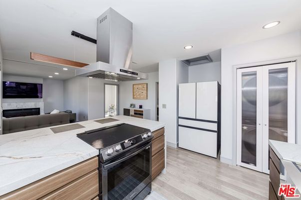 Fireplace, Interior, Kitchen, Recessed Lighting, Stainless Steel Appliances, Wood Texture Flooring