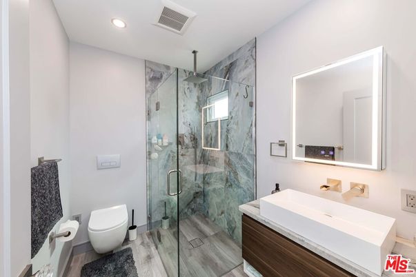 Bathroom, Glass Shower, Interior, Marble Walls, Recessed Lighting, Wood Texture Flooring