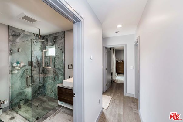 Bathroom, Glass Shower, Interior, Marble Walls, Recessed Lighting, Wood Texture Flooring