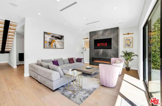Fireplace, Interior, Living room, Marble Walls, Recessed Lighting, Wood Texture Flooring