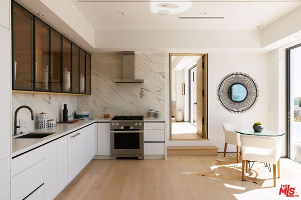 Interior, Kitchen, Marble Walls, Recessed Lighting, Stainless Steel Appliances, Wood Texture Flooring