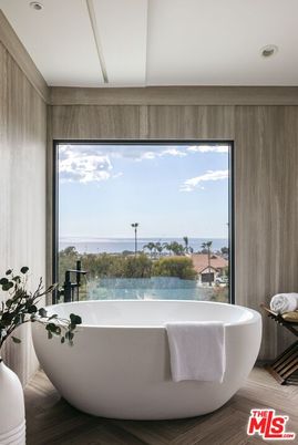 Bathroom, Free Standing Baths, Interior, Recessed Lighting, Water, Wood Texture Flooring