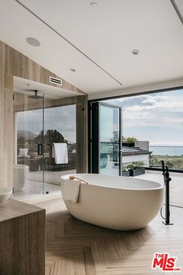 Bathroom, Free Standing Baths, Glass Shower, Interior, Recessed Lighting, Water, Wood Texture Flooring