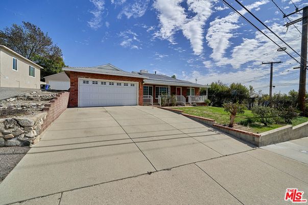 Attached, Exterior, Facade, Brick Facade, Solar Panels, Ranch