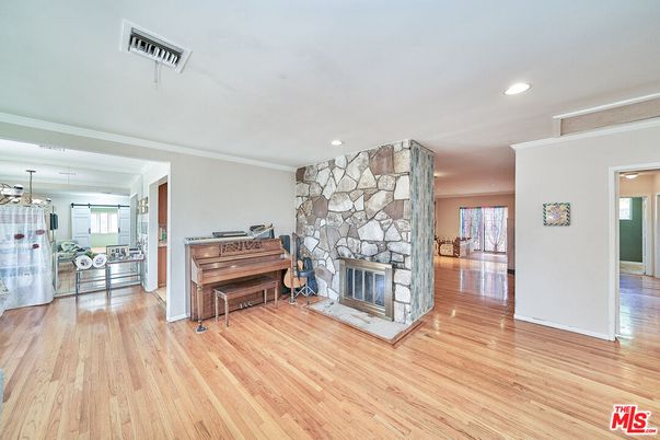 Fireplace, Interior, Piano, Recessed Lighting, Wood Texture Flooring