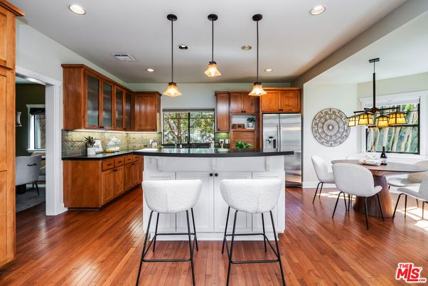 Dining room, Interior, Kitchen, Pendant Lights, Recessed Lighting, Stainless Steel Appliances, Wood Texture Flooring
