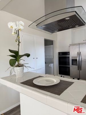 Interior, Kitchen, Stainless Steel Appliances, Tile Countertops, Wood Texture Flooring