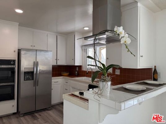 Interior, Kitchen, Recessed Lighting, Stainless Steel Appliances, Tile Countertops, Wood Texture Flooring