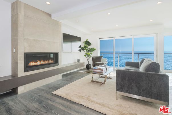 Fireplace, Interior, Living room, Recessed Lighting, Water, Wood Texture Flooring