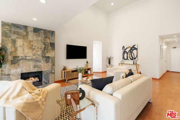 Fireplace, Interior, Living room, Recessed Lighting, Stone Walls, Wood Texture Flooring