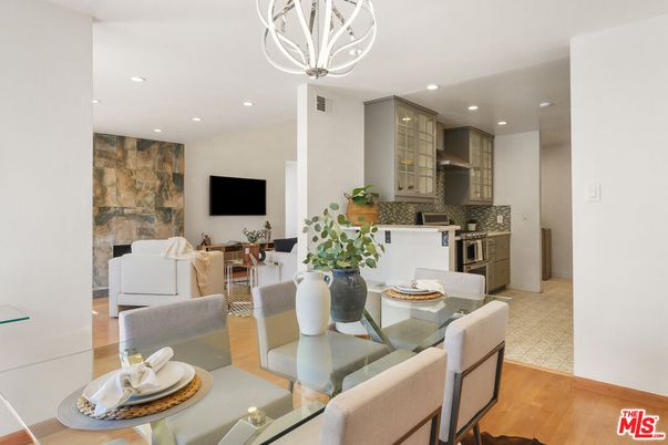 Dining room, Fireplace, Interior, Kitchen, Living room, Pendant Lights, Recessed Lighting, Stainless Steel Appliances, Stone Walls, Wood Texture Flooring