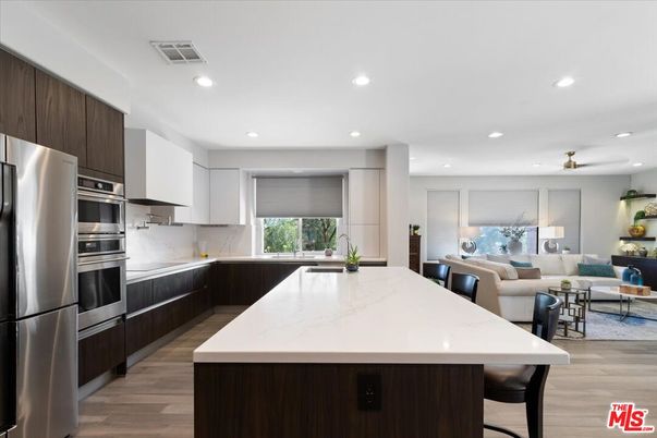 Dining room, Interior, Kitchen, Living room, Recessed Lighting, Stainless Steel Appliances, Wood Texture Flooring