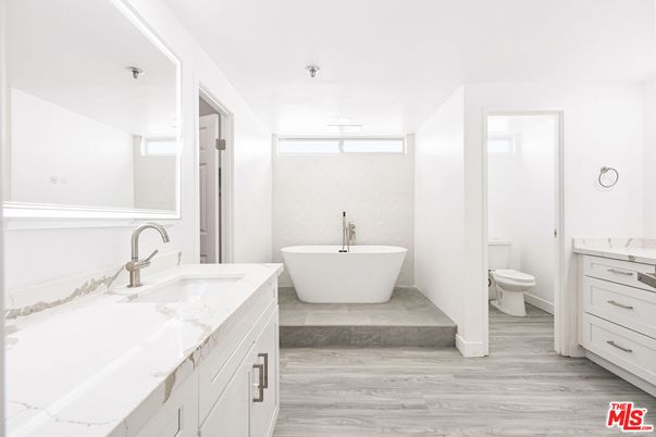 Bathroom, Dual Sink Vanities, Free Standing Baths, Interior, Wood Texture Flooring