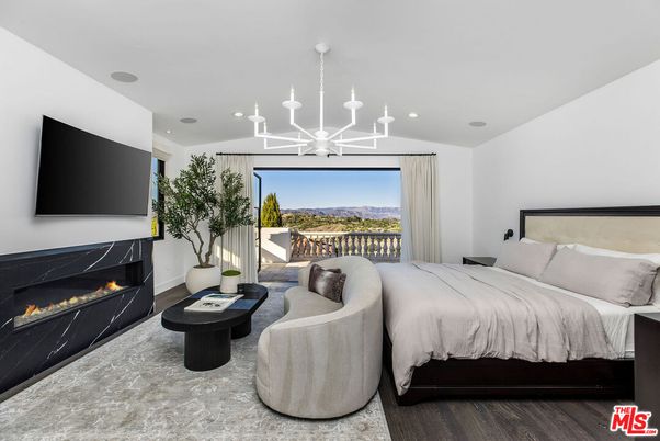 Bedroom, Chandelier, Fireplace, Interior, Recessed Lighting, Wood Texture Flooring