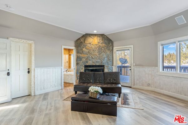 Fireplace, Interior, Recessed Lighting, Stone Walls, Wood Texture Flooring