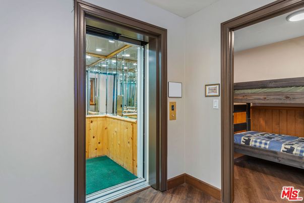 Elevator, Interior, Recessed Lighting, Wood Texture Flooring, Wooden Walls
