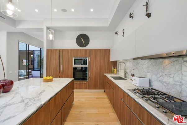 Interior, Kitchen, Marble Walls, Pendant Lights, Recessed Lighting, Stainless Steel Appliances, Wood Texture Flooring