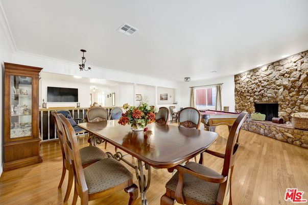 Billiard Table, Dining room, Fireplace, Interior, Pendant Lights, Stone Walls, Wood Texture Flooring
